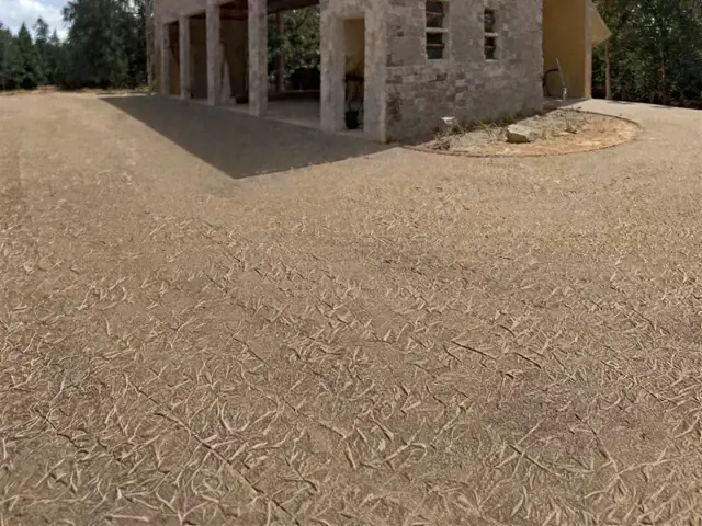 Wide paved apron in front of a covered entrance